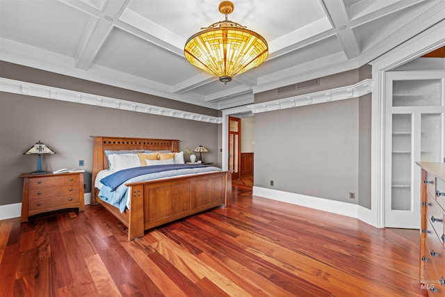 bedroom featuring beam ceiling, hardwood / wood-style floors, and coffered ceiling