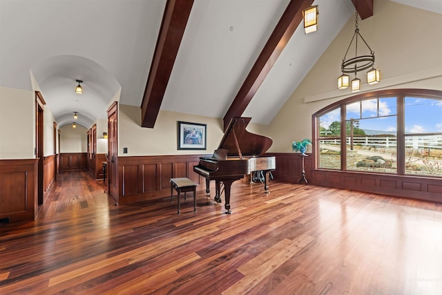 misc room with hardwood / wood-style floors, beam ceiling, and high vaulted ceiling