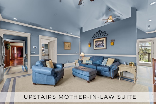 carpeted living room with ceiling fan, crown molding, and high vaulted ceiling