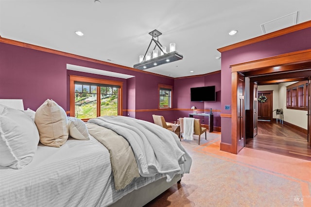 bedroom featuring crown molding and hardwood / wood-style flooring