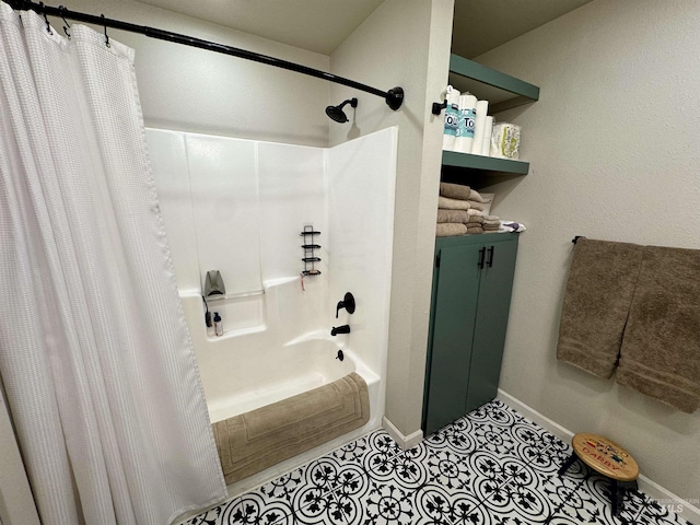 full bathroom with tile patterned flooring, baseboards, and shower / tub combo with curtain