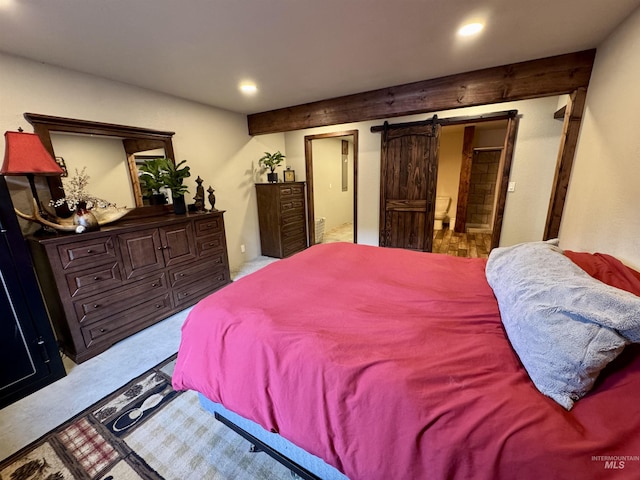 bedroom featuring ensuite bath, carpet, a barn door, and recessed lighting