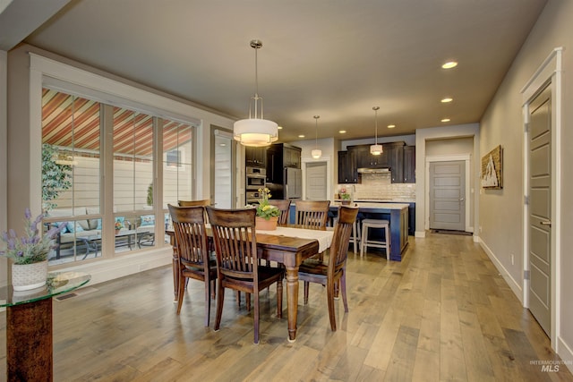 dining space with recessed lighting, baseboards, visible vents, and light wood finished floors