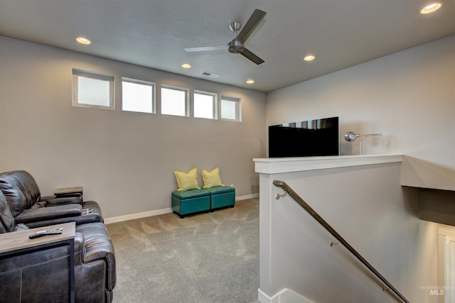 living room featuring light carpet, baseboards, visible vents, and recessed lighting