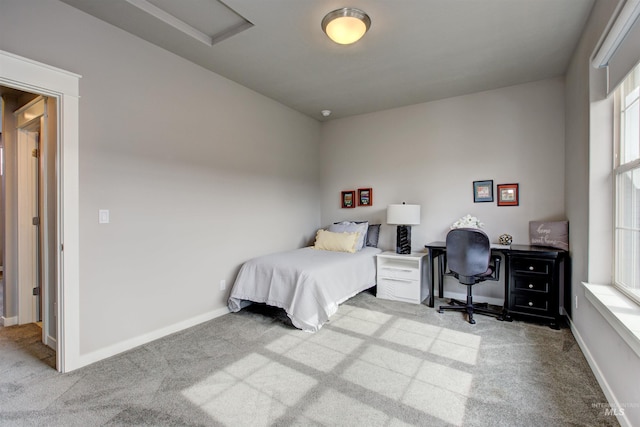 carpeted bedroom with baseboards