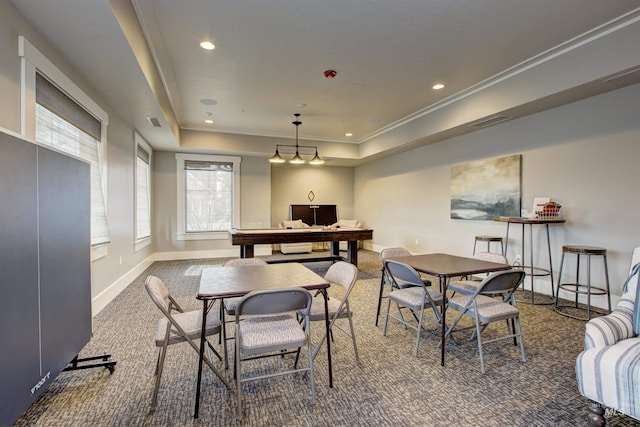 dining room featuring recessed lighting, baseboards, carpet, a raised ceiling, and crown molding