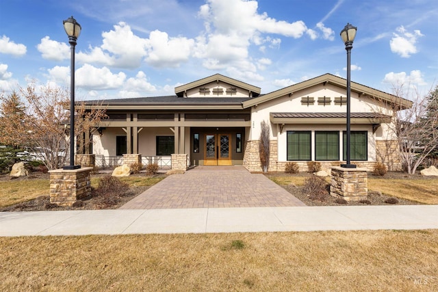 view of property featuring decorative driveway