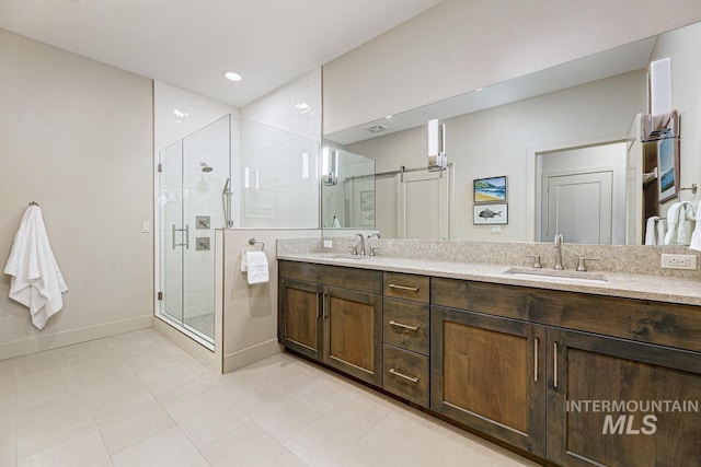 880 W River St, Boise, ID 83702 - bathroom with double vanity, a sink, baseboards, and a stall shower