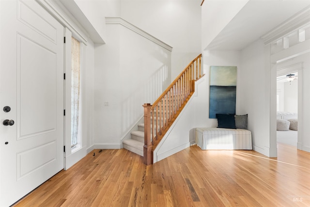 entrance foyer with ceiling fan and light hardwood / wood-style floors