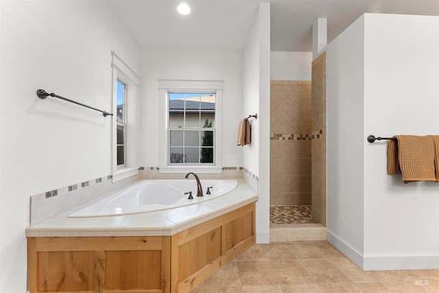 bathroom featuring separate shower and tub and tile patterned flooring