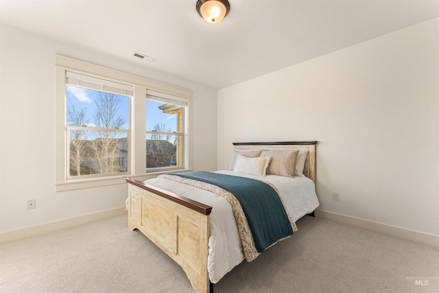 bedroom with light carpet