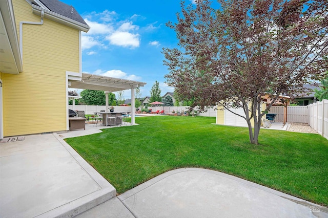 view of yard with a patio area, a storage shed, and a pergola