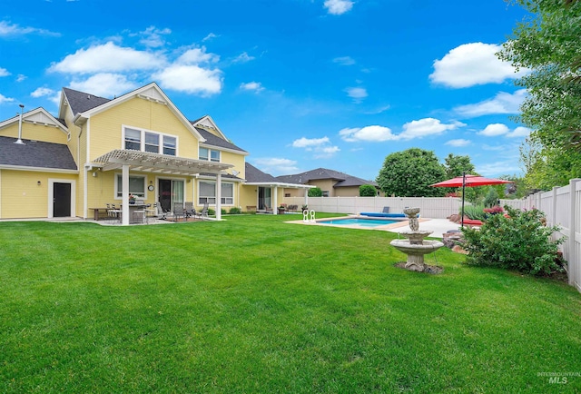 back of property featuring a pergola, a fenced in pool, a lawn, and a patio