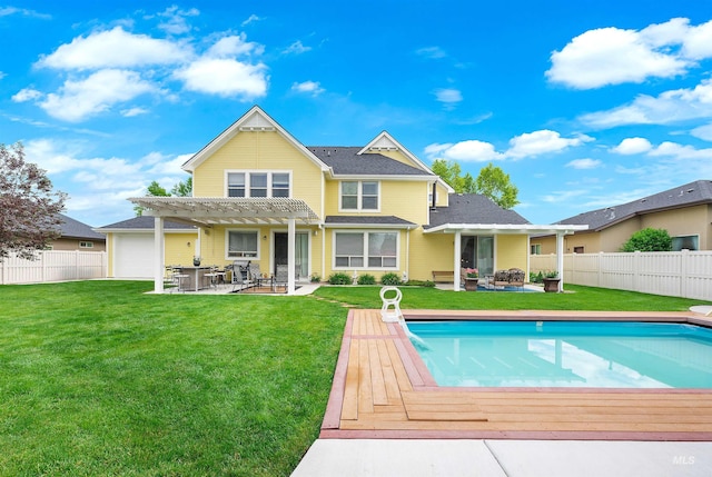 back of property with a patio area, a fenced in pool, a yard, and a pergola