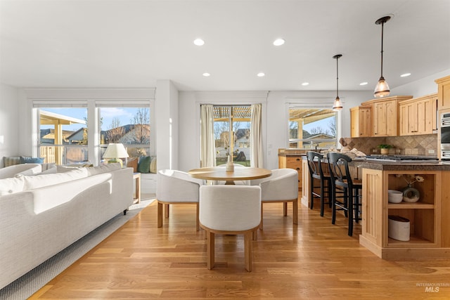 dining area with light wood-type flooring