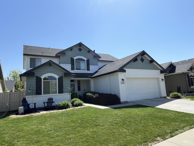 view of front of house featuring a garage, driveway, and roof with shingles