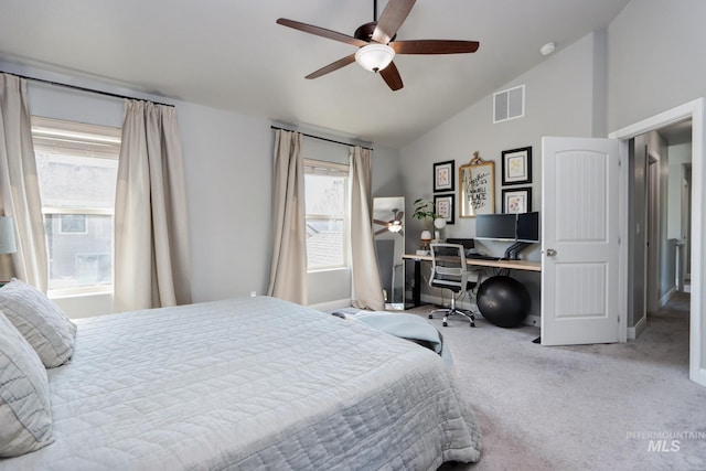 carpeted bedroom with lofted ceiling, a desk, ceiling fan, and baseboards