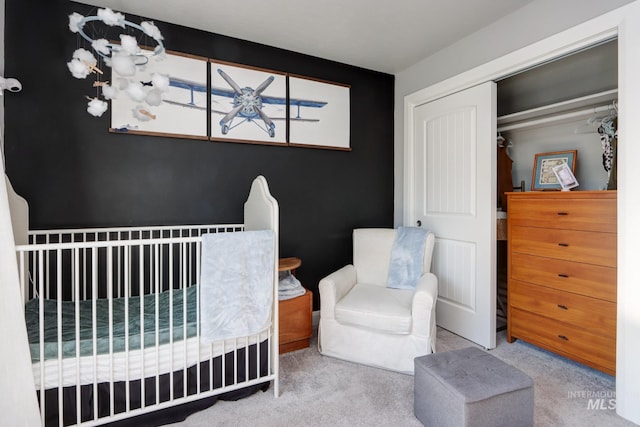 bedroom featuring carpet and a closet