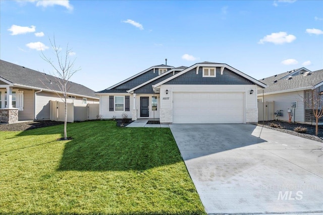 view of front of home featuring a garage and a front yard