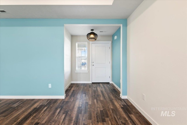 entrance foyer featuring dark wood-type flooring