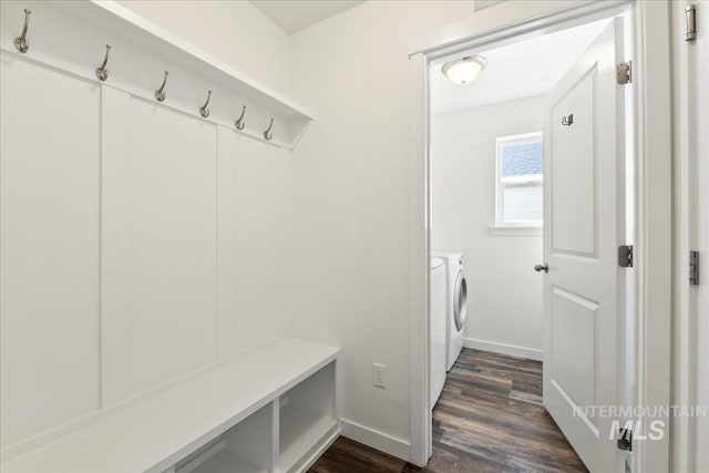 mudroom with separate washer and dryer and dark wood-type flooring