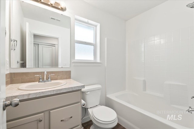 full bathroom featuring vanity, toilet, and shower / bathing tub combination