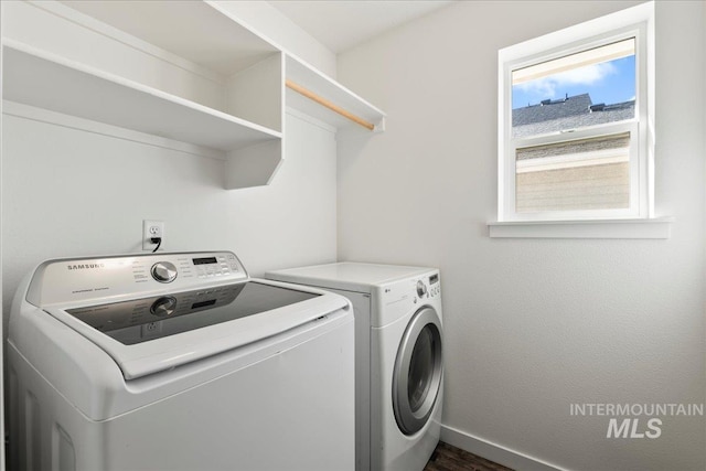 laundry room with washing machine and clothes dryer