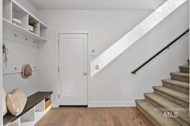 mudroom featuring baseboards and light wood-style flooring