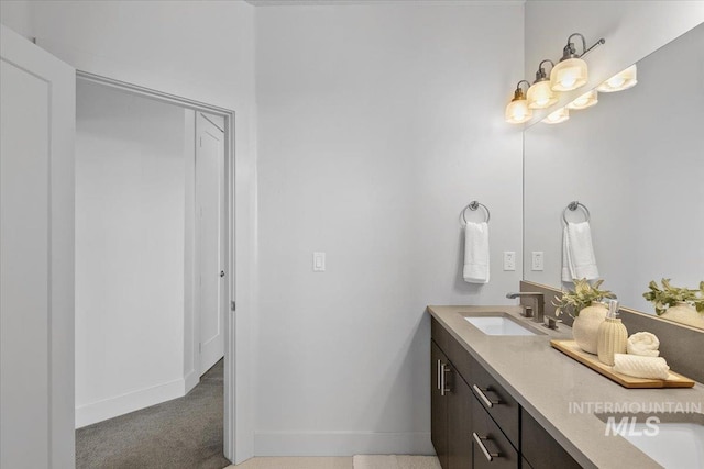 bathroom featuring vanity and baseboards