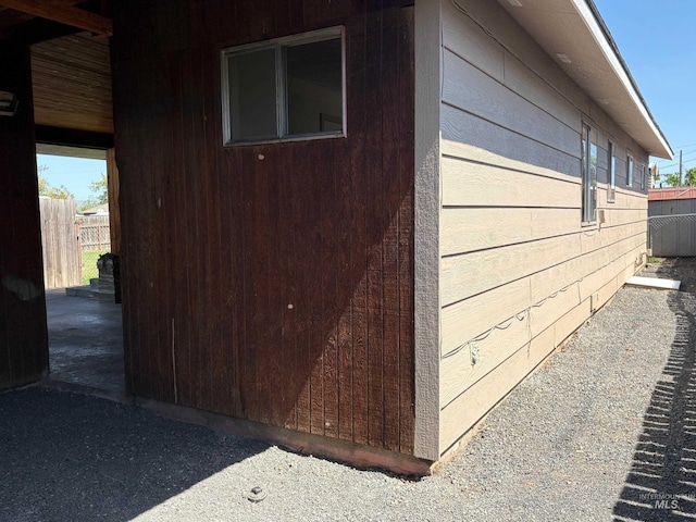 view of side of property with fence