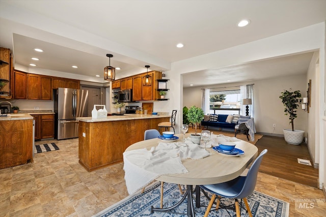 dining space featuring recessed lighting and visible vents