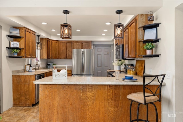 kitchen featuring a peninsula, open shelves, appliances with stainless steel finishes, and a sink