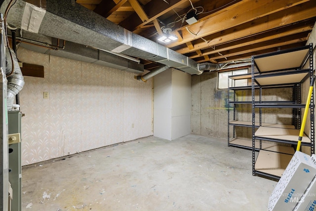 unfinished basement with wallpapered walls
