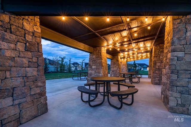 view of patio terrace at dusk