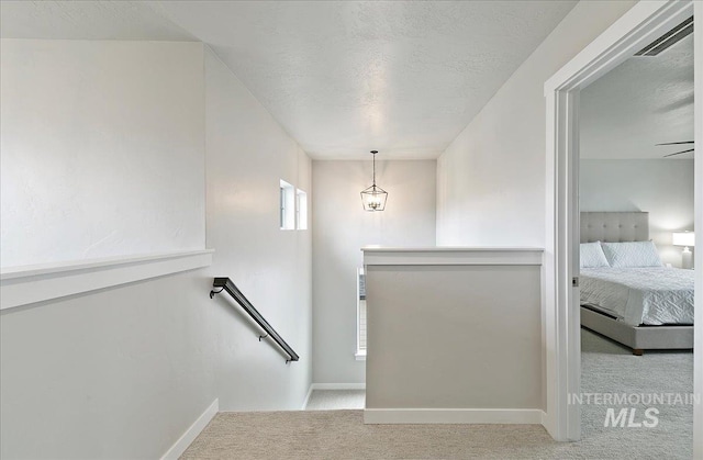 5094 W Avilla Dr, Meridian, ID 83646 - stairway featuring carpet floors, baseboards, and a textured ceiling