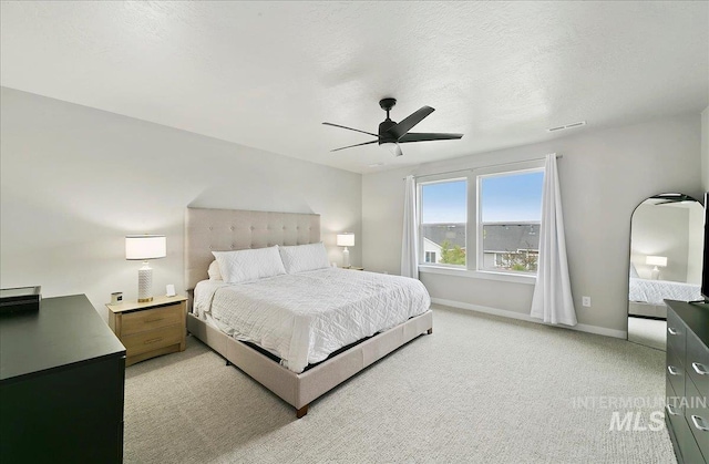 5094 W Avilla Dr, Meridian, ID 83646 - bedroom featuring baseboards, light carpet, and a ceiling fan