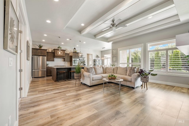 1071 W Rose Quartz St, Kuna, ID 83634 - living room with a ceiling fan, light wood-style flooring, recessed lighting, beam ceiling, and baseboards