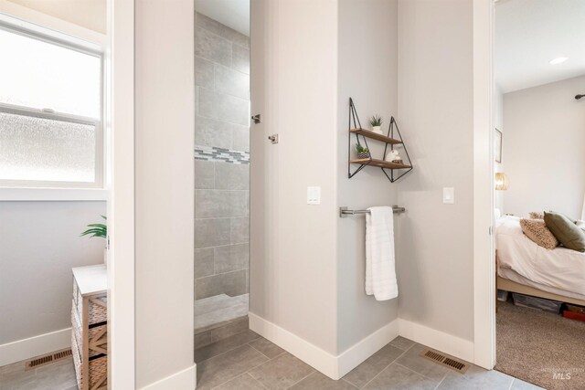 1071 W Rose Quartz St, Kuna, ID 83634 - ensuite bathroom featuring walk in shower and baseboards