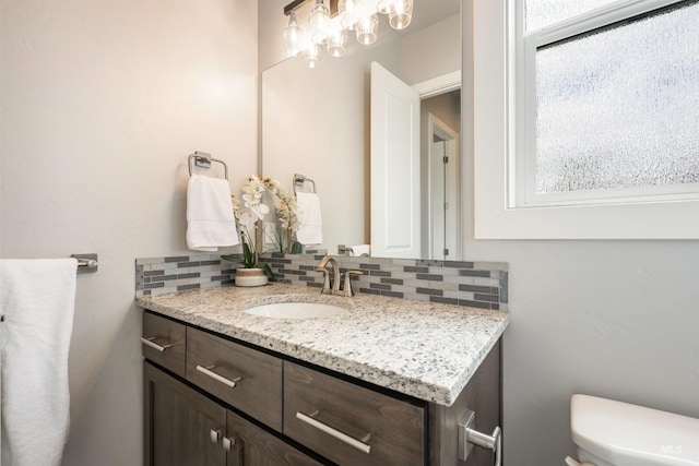 1071 W Rose Quartz St, Kuna, ID 83634 - bathroom with backsplash, toilet, and vanity