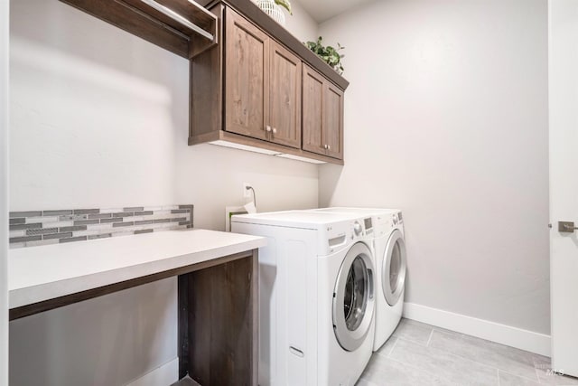 1071 W Rose Quartz St, Kuna, ID 83634 - washroom featuring cabinet space, separate washer and dryer, baseboards, and light tile patterned floors