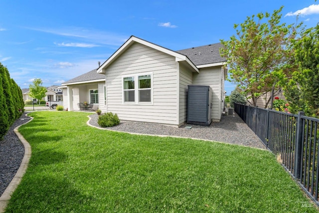 1071 W Rose Quartz St, Kuna, ID 83634 - rear view of property featuring a shingled roof and central AC unit