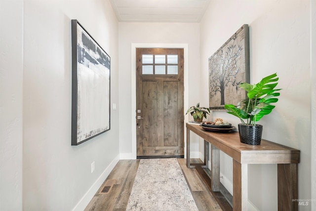 1071 W Rose Quartz St, Kuna, ID 83634 - doorway with wood finished floors and baseboards