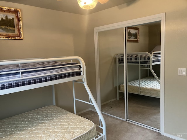 unfurnished bedroom featuring carpet, a closet, and baseboards