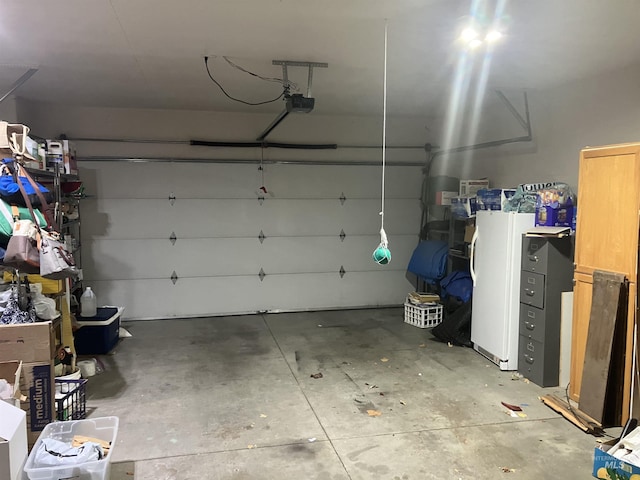 garage featuring a garage door opener