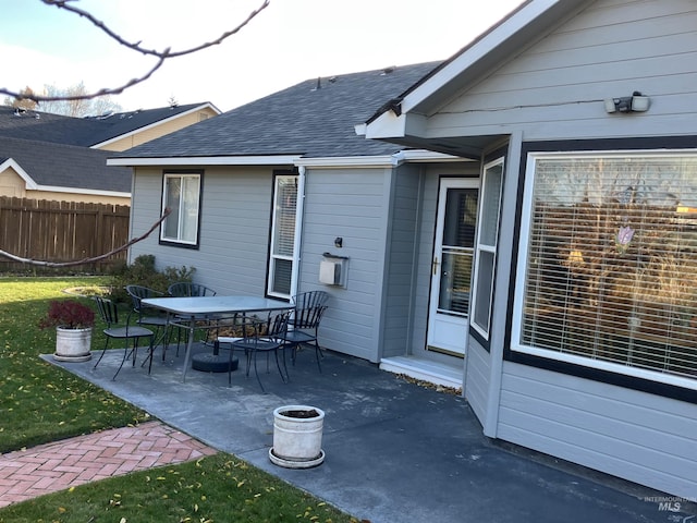 view of patio / terrace with outdoor dining space and fence