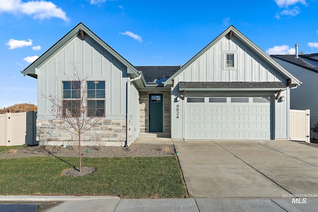 1724 Black Elm, Star, ID 83669 - view of front of home with a front lawn, driveway, stone siding, board and batten siding, and a garage