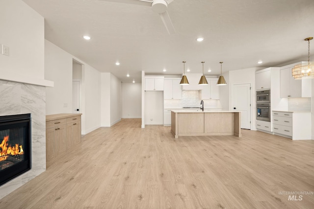 1724 Black Elm, Star, ID 83669 - unfurnished living room with a tile fireplace, light wood finished floors, and recessed lighting