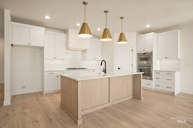 1724 Black Elm, Star, ID 83669 - kitchen featuring stainless steel double oven, backsplash, light countertops, light wood-style floors, and recessed lighting