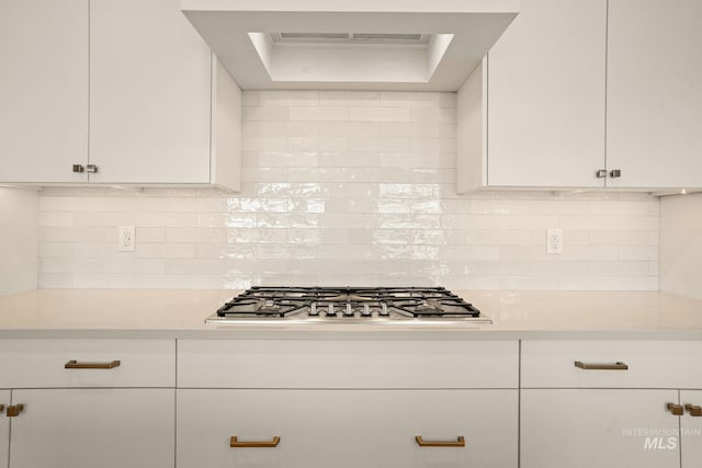 1724 Black Elm, Star, ID 83669 - kitchen featuring stainless steel gas stovetop, light countertops, and white cabinets