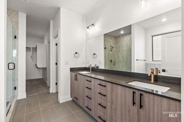 1724 Black Elm, Star, ID 83669 - full bathroom with tile patterned flooring, baseboards, a sink, and a stall shower